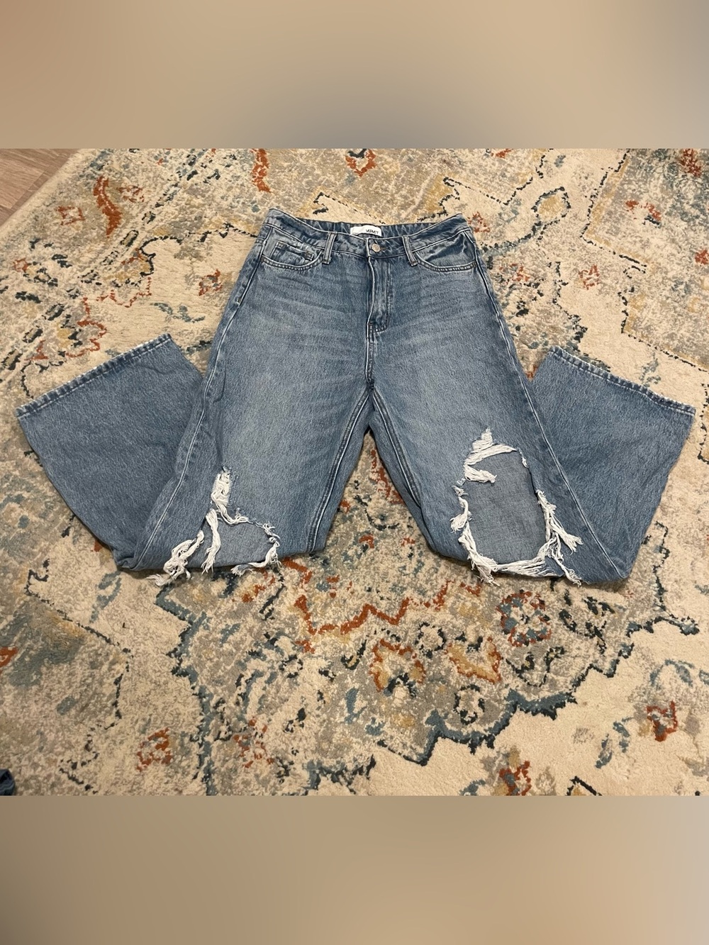High-Rise Light Blue Boyfriend Jeans with Distressed Knees